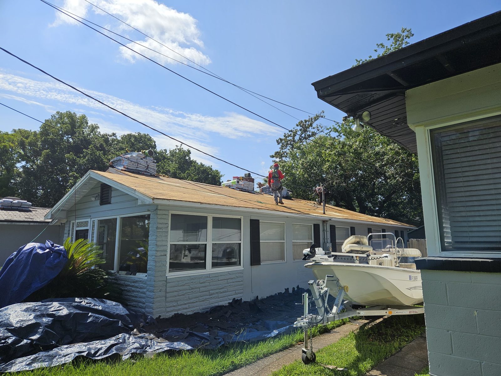 The Just Roofs crew tearing off and replacing a roof in Jacksonville, FL