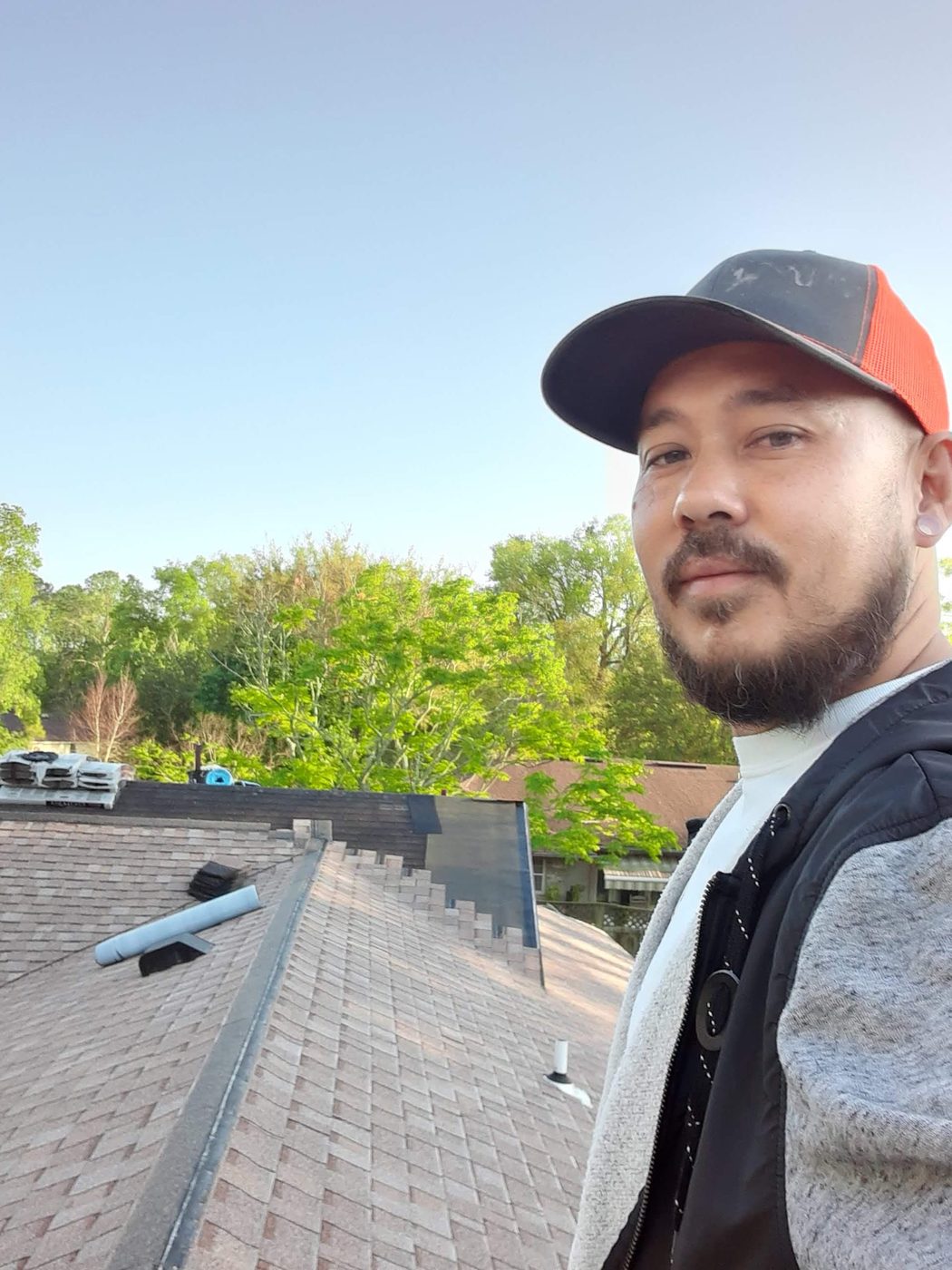 Trace, owner of Just Roofs Inc, on a completed roof in Jacksonville, FL