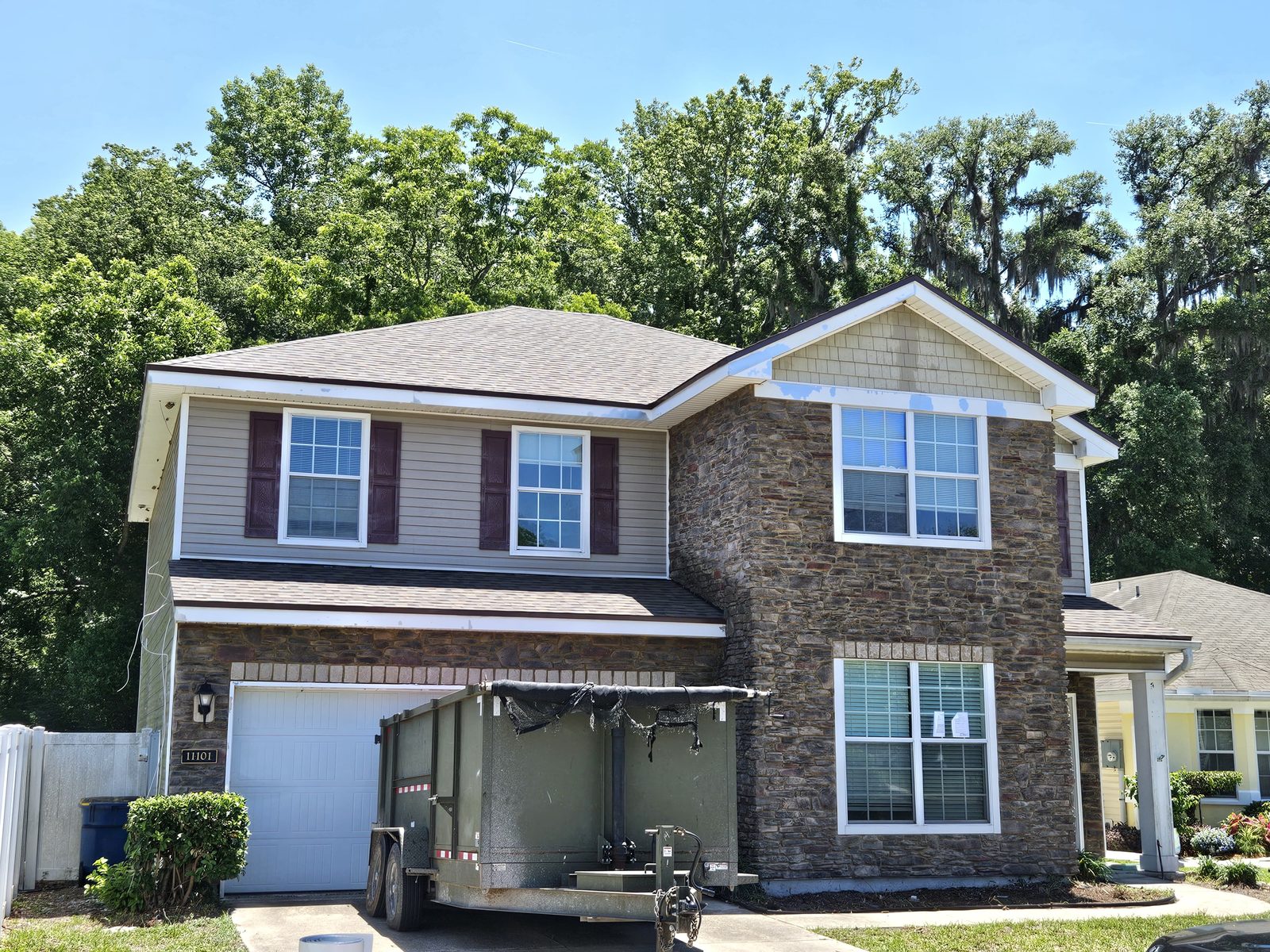 Full roof replacement in progress on a two-story Jacksonville home